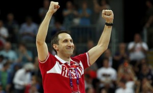 Russia's head coach Blatt celebrates victory against Brazil after the men's preliminary round Group B basketball match at the Basketball Arena during the London 2012 Olympic Games