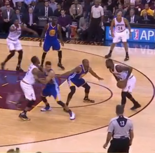 Curry arms locks and tries to re-direct J.R. Smith to prevent a clean screen.